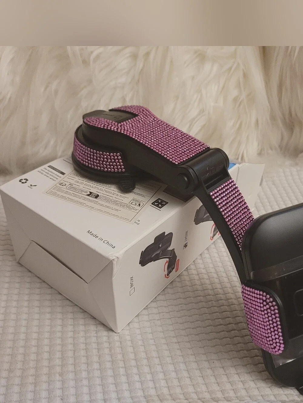 Pink universal car phone holder designed for attachment to a dashboard